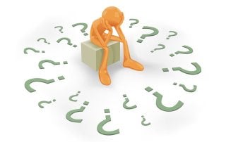 person sitting on box with hands on face and surrounded by question marks struggle with data